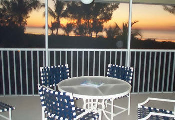 Tortuga Beach Club - Screened porch at sunset