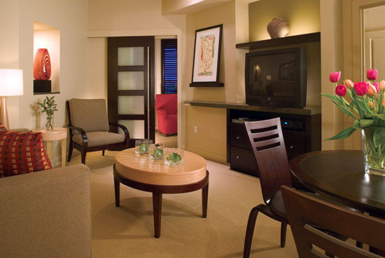 Westin Kierland Villas - Living/dining area of the one-bedroom deluxe villa features a queen sleeper sofa and formal dining